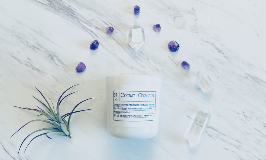 The Crown Chakra candle is a warm, rich blend of frankincense and smokey fireside.